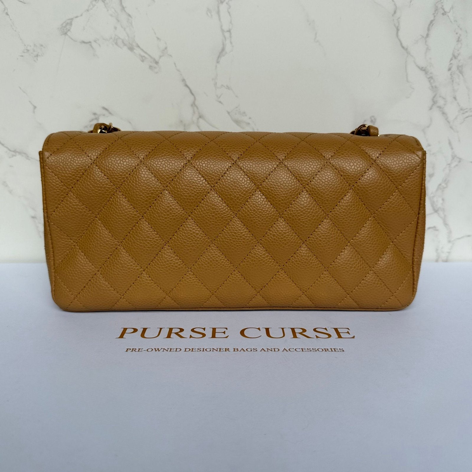 back Chanel East West flap beige caviar