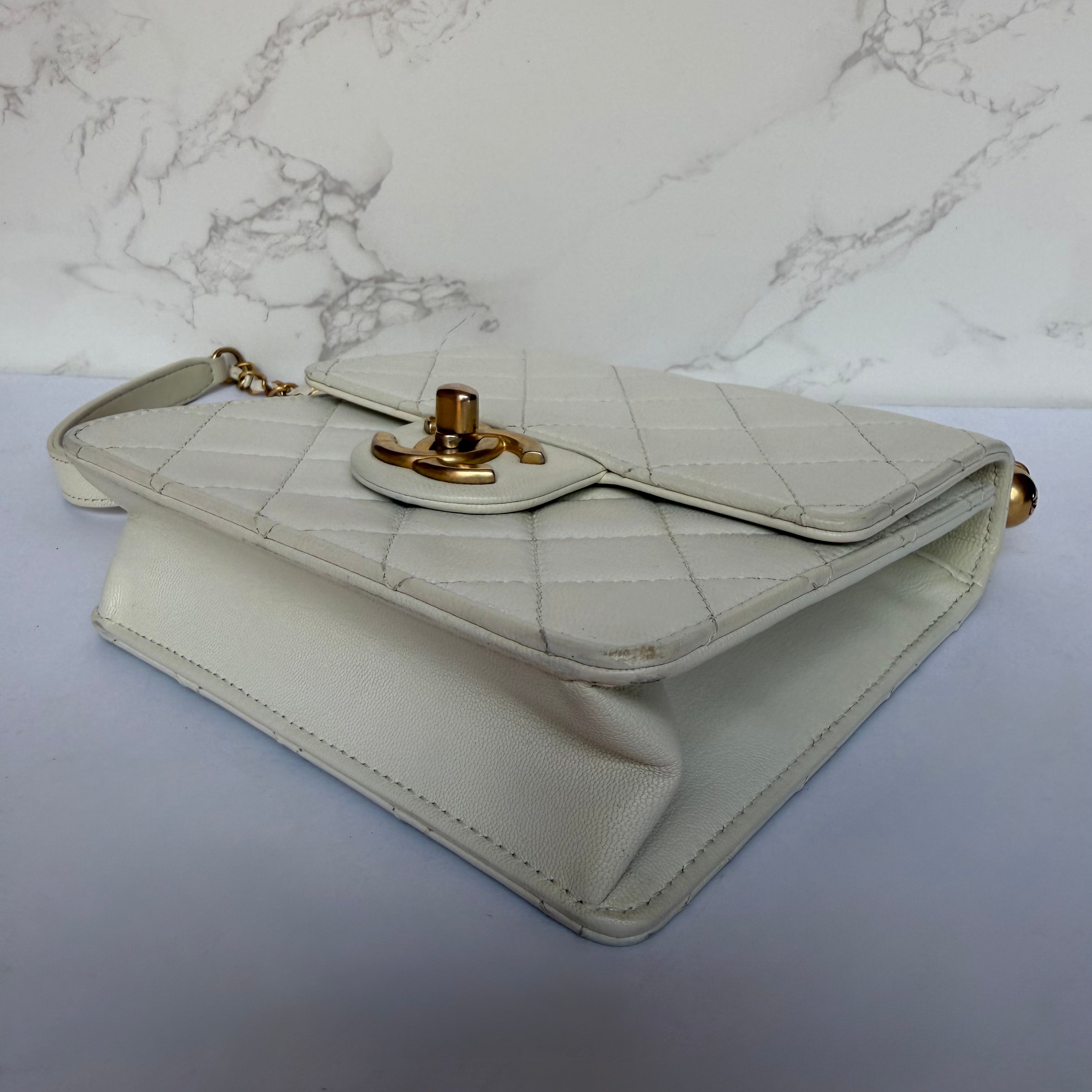 Chanel chic pearl flap bag