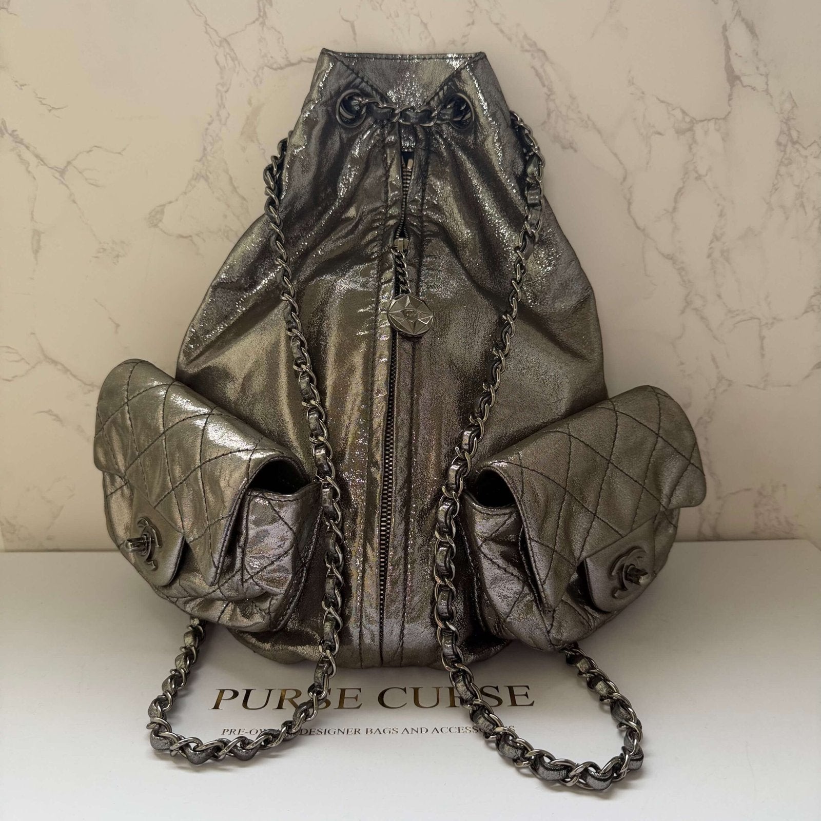 original pre-owned Chanel silver backpack