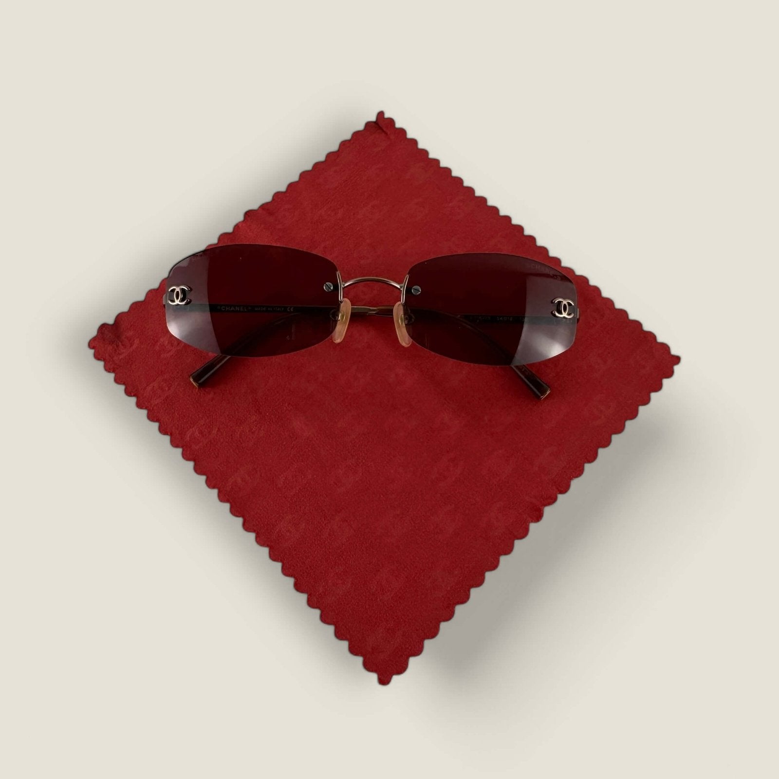 pre-owned Chanel sunglasses with polishing cloth