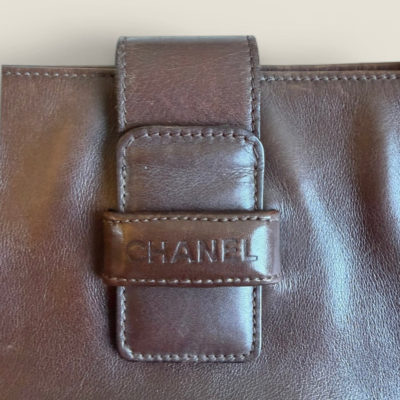 vintage Chanel brown lambskin tote embossed logo closure