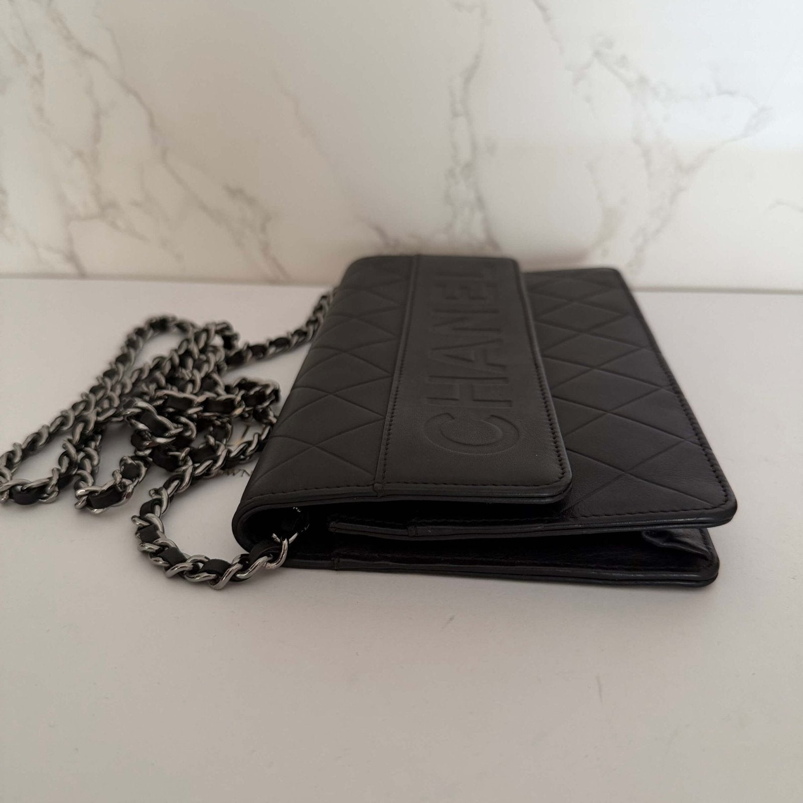 Chanel Black Quilted Lambskin Embossed LAX Wallet On Chain chain strap detail
