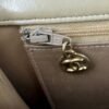 Pre-loved Chanel purse made from beige lambskin leather with gold hardware