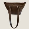 Tweedehands Chanel tote schoudertas bruin leer met Purse Curse tassenhouder tafel