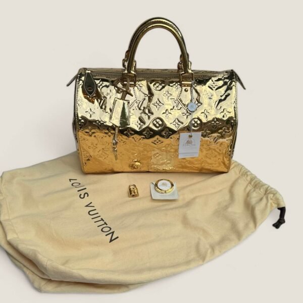 Louis Vuitton pre-loved gold monogram Miroir Speedy 35 gold leather