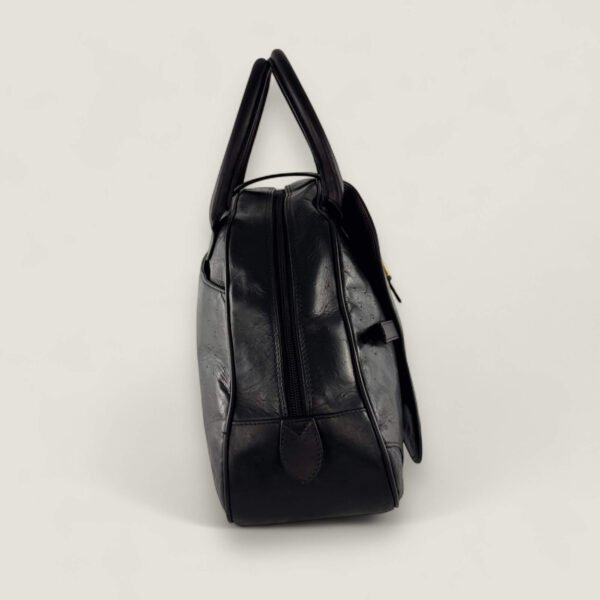 Zijkant tweedehands Dior saddle handtas