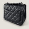 pre-owned Chanel mini crossbody black lambskin