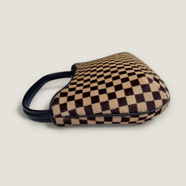 Louis Vuitton Tigre hoekje lichte wrijving