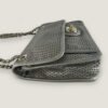 Zijaanzicht authentieke Chanel tas