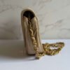 Zijkant Chanel half moon flap beige