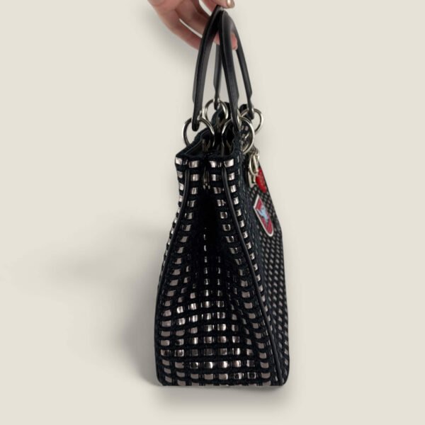 Zijaanzicht authentieke designer tas Dior