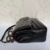 Chanel reversed chevron flap bag zijkant