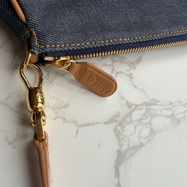 Dior denim saddle pochette close up Dior denim saddle pochette close up