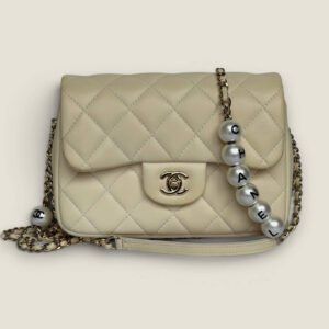 Chanel small quilted lambskin my precious pearl chain flap Chanel small quilted lambskin my precious pearl chain flap