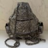Chanel mini backpack achterkant Mona Lisa pocket